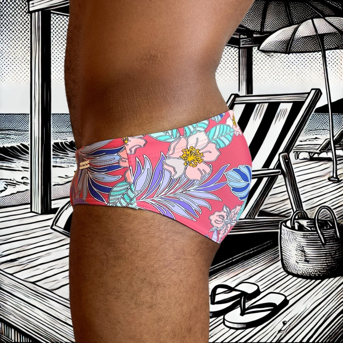 Maillot de bain homme Le Beau Tom — vue de face, coupe taille basse, confort et élégance française, fleuri, tropical, modèle Pink Paradise, vue de profil gauche